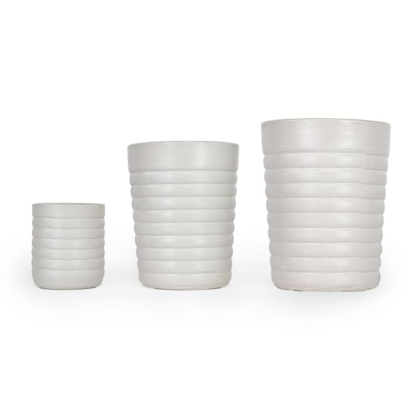Three white ceramic 3D printed drinking cups, with a ridge pattern of different sizes on a white background