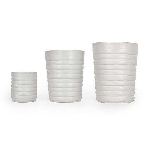 Three white ceramic 3D printed drinking cups, with a ridge pattern of different sizes on a white background