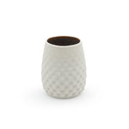 Porcelain drinking cup with a stemless dot pattern, with a dark interior design on a white background