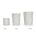 Three white textured 3D printed ceramic drinking cups with a wave twist pattern on a white background