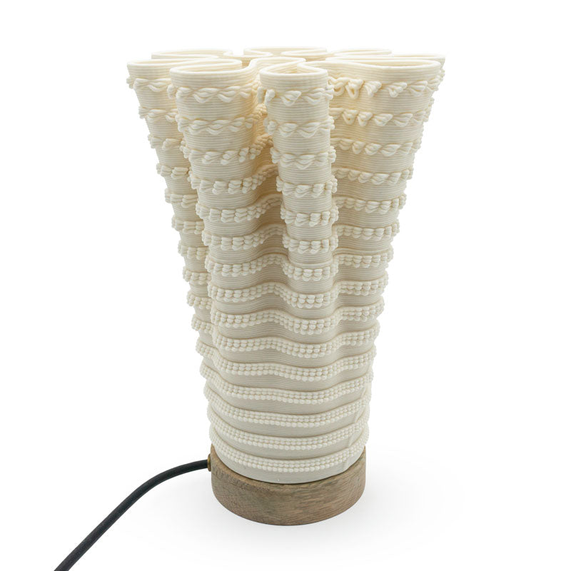 Coral-like textured translucent porcelain table lamp on a white background