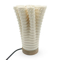 Coral-like textured translucent porcelain table lamp on a white background