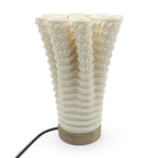 Coral-like textured translucent porcelain table lamp on a white background