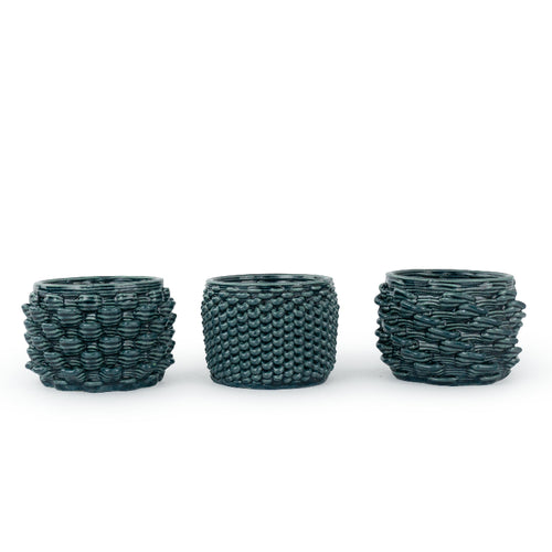 Three textured 3D printed ceramic cactus planters with different design patterns: loop, twist, and petal