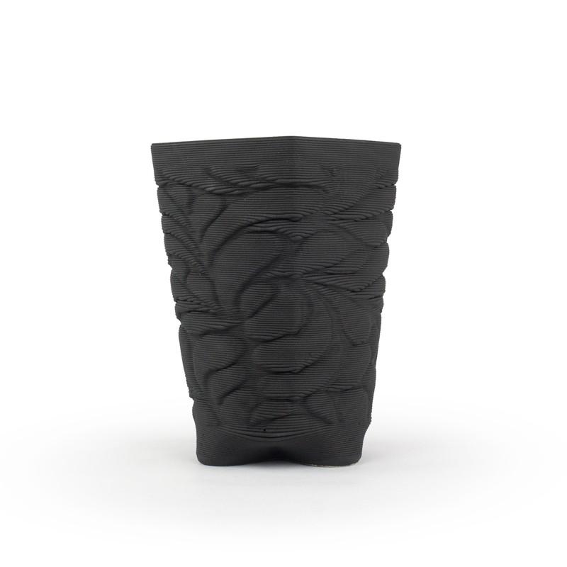 Matte black textured 3D ceramic printed chalice planter, with a bloom pattern on a white background