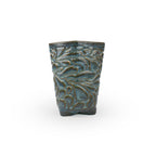 Blue rutile colored textured 3D ceramic printed chalice planter, with a bloom pattern on a white background