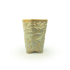 Light sepira textured 3D ceramic printed chalice planter, with a bloom pattern on a white background