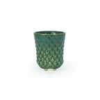 A textured green 3D printed ceramic dot patterned chalice planters on a white background