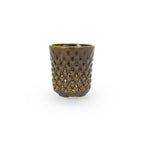 A textured brown 3D printed ceramic dot patterned chalice planters on a white background