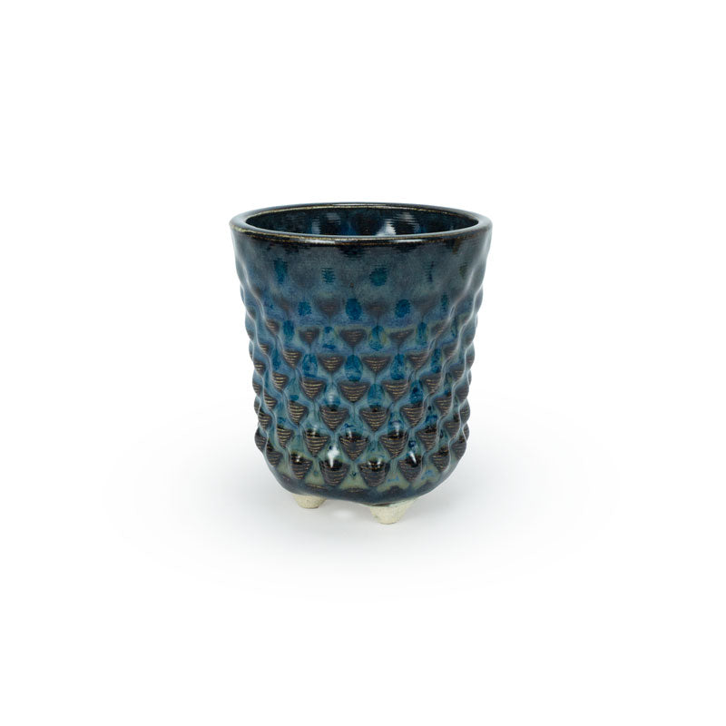 A textured blue 3D printed ceramic dot patterned chalice planters on a white background