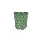 A textured green 3D printed ceramic dot patterned chalice planters on a white background