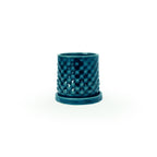 Storm colored 3D printed ceramic planter with a dot pattern, with a tray on a white background