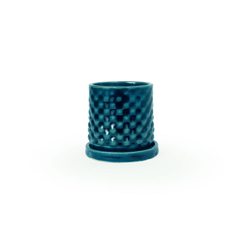 Storm colored 3D printed ceramic planter with a dot pattern, with a tray on a white background