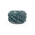 Storm colored 3D printed ceramic cactus planter or tea light holder with a twist pattern, on a white background