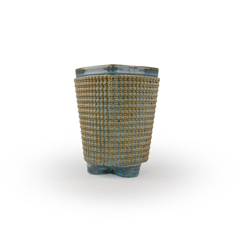 A textured blue rutile chalice 3D printed ceramic planter with a micro scallop pattern on a white background
