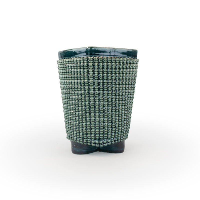 A green chalice 3D printed ceramic planter with a micro scallop pattern on a white background