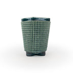 A green chalice 3D printed ceramic planter with a micro scallop pattern on a white background