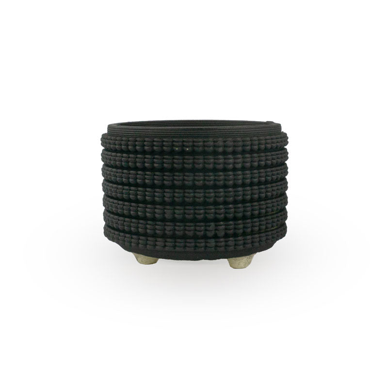 Textured 3D printed ceramic matte black colored planter, on a white background