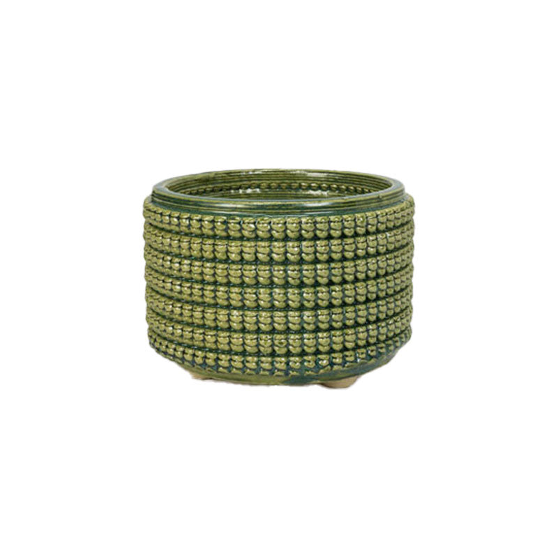 Textured 3D printed ceramic emerald falls colored planter, on a white background