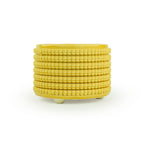 Textured 3D printed ceramic marigold colored planter, on a white background