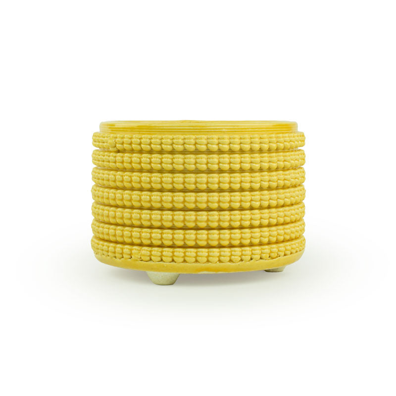 Textured 3D printed ceramic marigold colored planter, on a white background