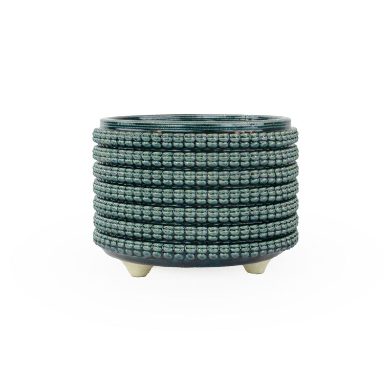 Textured 3D printed ceramic storm colored planter, on a white background