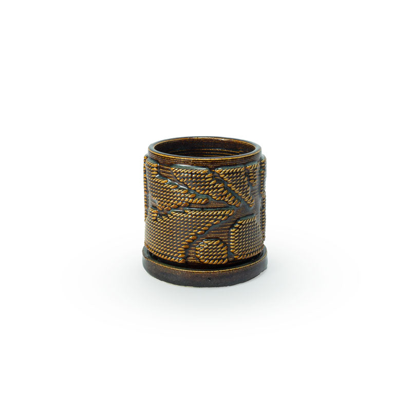 Iron lustre colored 3D printed ceramic planter with pixel paisley pattern, with a tray on a white background
