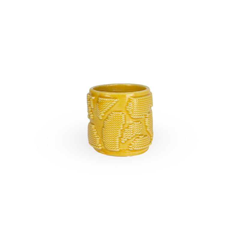 Marigold colored 3D printed ceramic planter with pixel paisley pattern on a white background