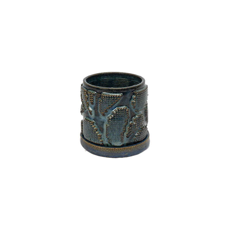 Sapphire float colored 3D printed ceramic planter with pixel paisley pattern, with a tray on a white background