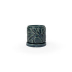 Storm colored 3D printed ceramic planter with pixel paisley pattern, with a tray on a white background