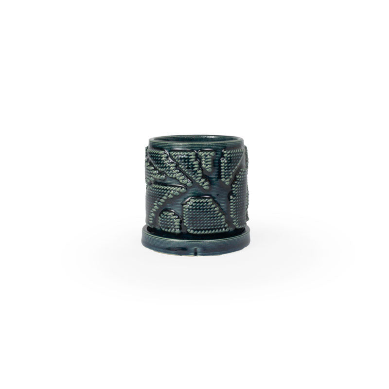 Storm colored 3D printed ceramic planter with pixel paisley pattern, with a tray on a white background