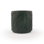 Matte black colored 3D printed ceramic planter with pixel paisley pattern on a white background