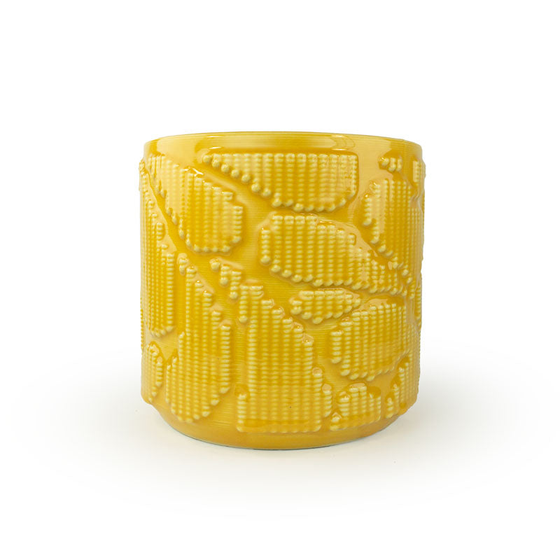 Marigold colored 3D printed ceramic planter with pixel paisley pattern on a white background