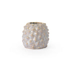 Light sepia colored 3D printed ceramic planter with a pineapple pattern, on a white background
