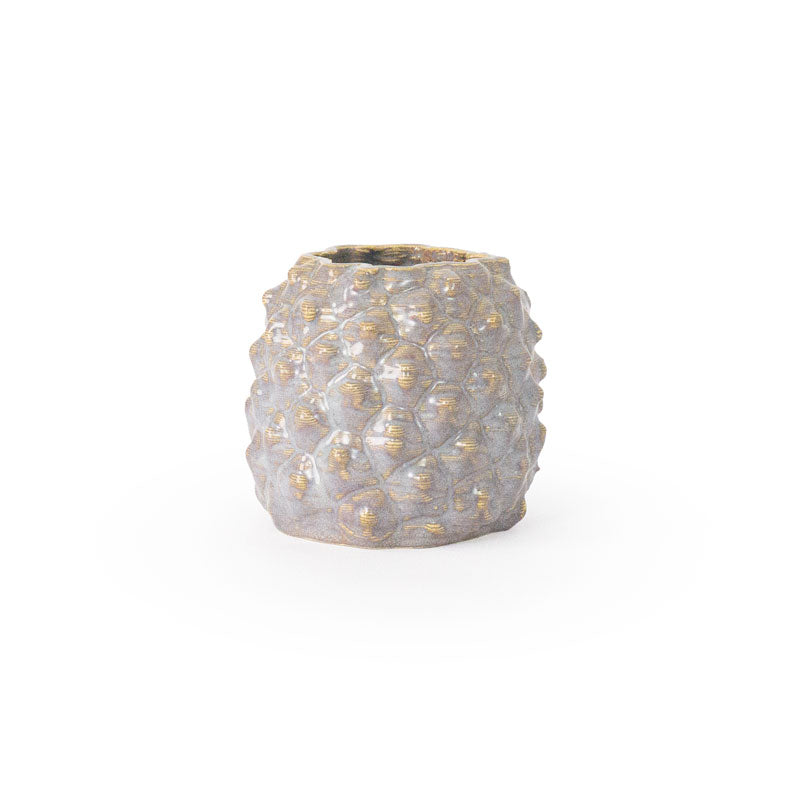 Light sepia colored 3D printed ceramic planter with a pineapple pattern, on a white background