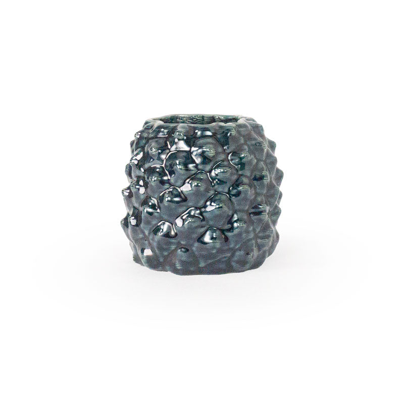 Storm colored 3D printed ceramic planter with a pineapple pattern, on a white background