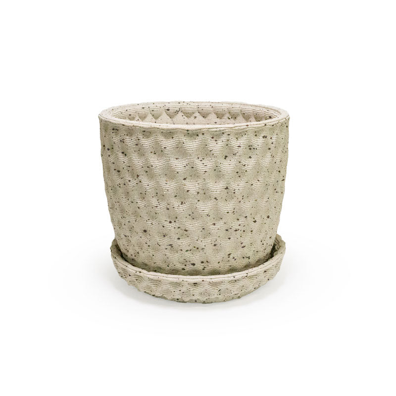 a close up of a 3D ceramic printed planter with a diamond pattern and speckles, with a tray
