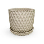 a close up of a 3D ceramic printed planters with a diamond pattern and speckles, with a tray