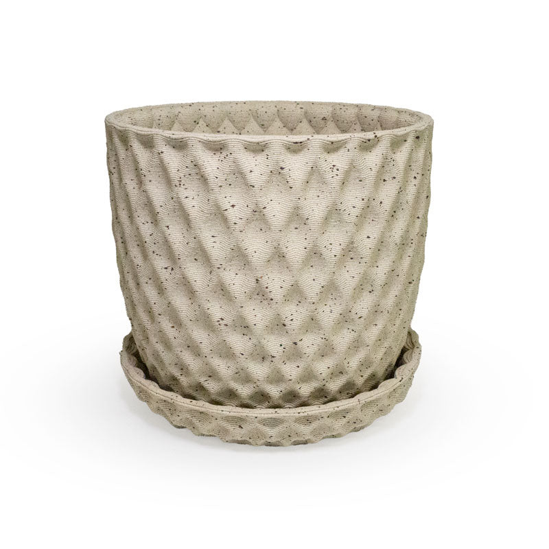 a close up of a 3D ceramic printed planters with a diamond pattern and speckles, with a tray