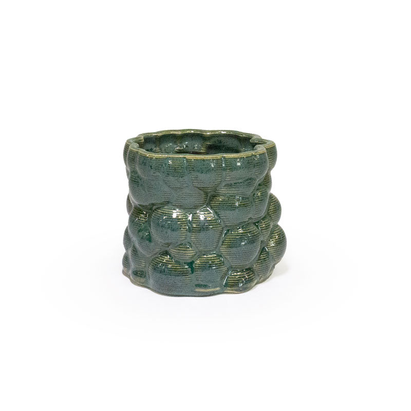 3D printed ceramic planter with a dark green bubble pattern on a white background