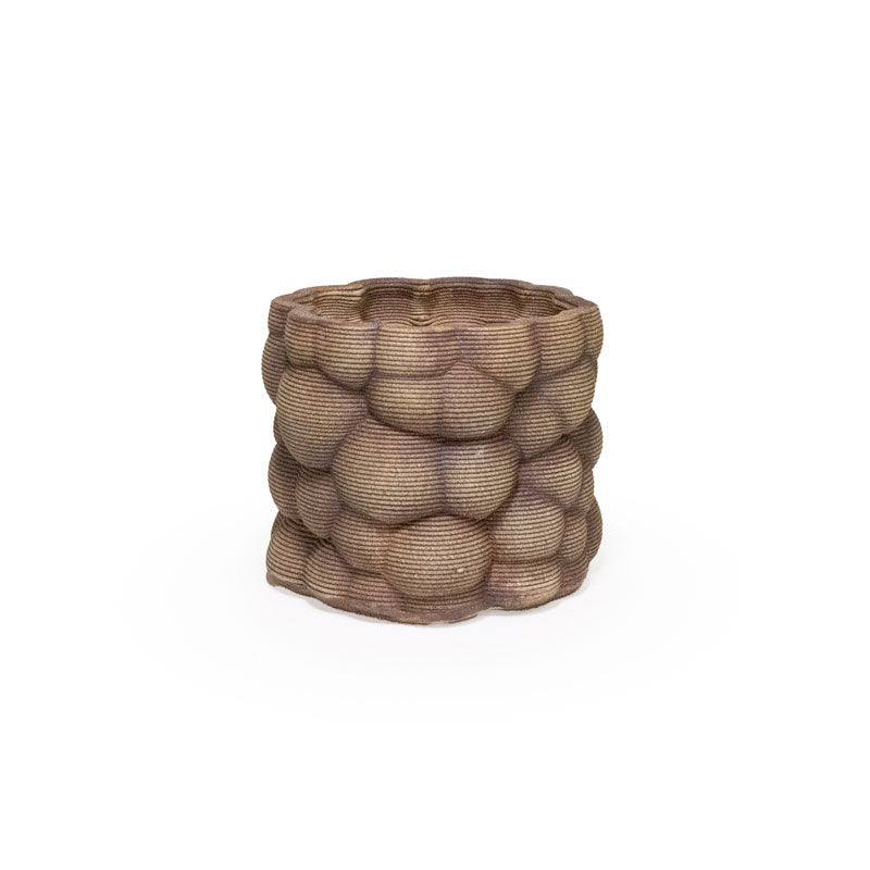 3D printed ceramic planter with a red iron oxide bubble pattern on a white background