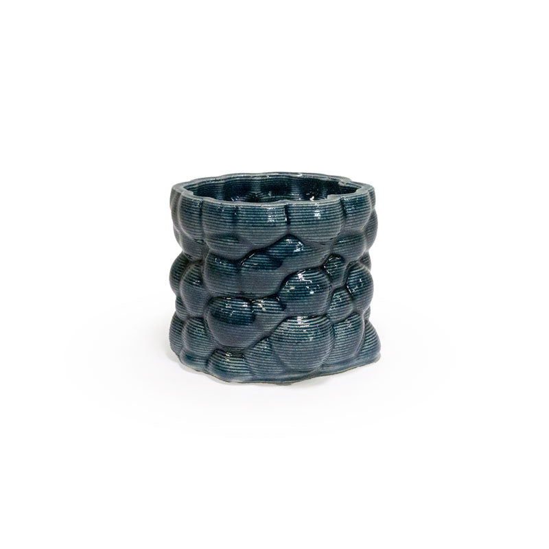 3D printed ceramic planter with a storm blue bubble pattern on a white background