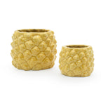 Two marigold colored 3D printed ceramic planter with a pineapple pattern of different sizes, on a white background