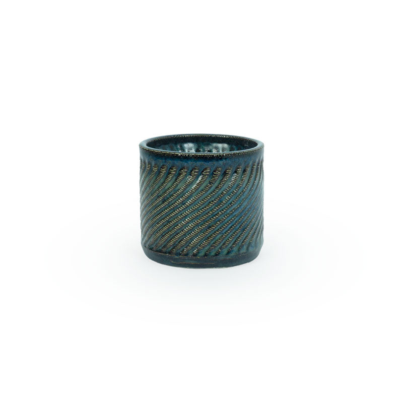 Sapphire float colored 3D printed ceramic planter with a swirl pattern on a white background