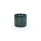 Sapphire float colored 3D printed ceramic planter with a swirl pattern on a white background