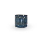 Sapphire float colored 3D printed ceramic planter with a swirl pattern on a white background