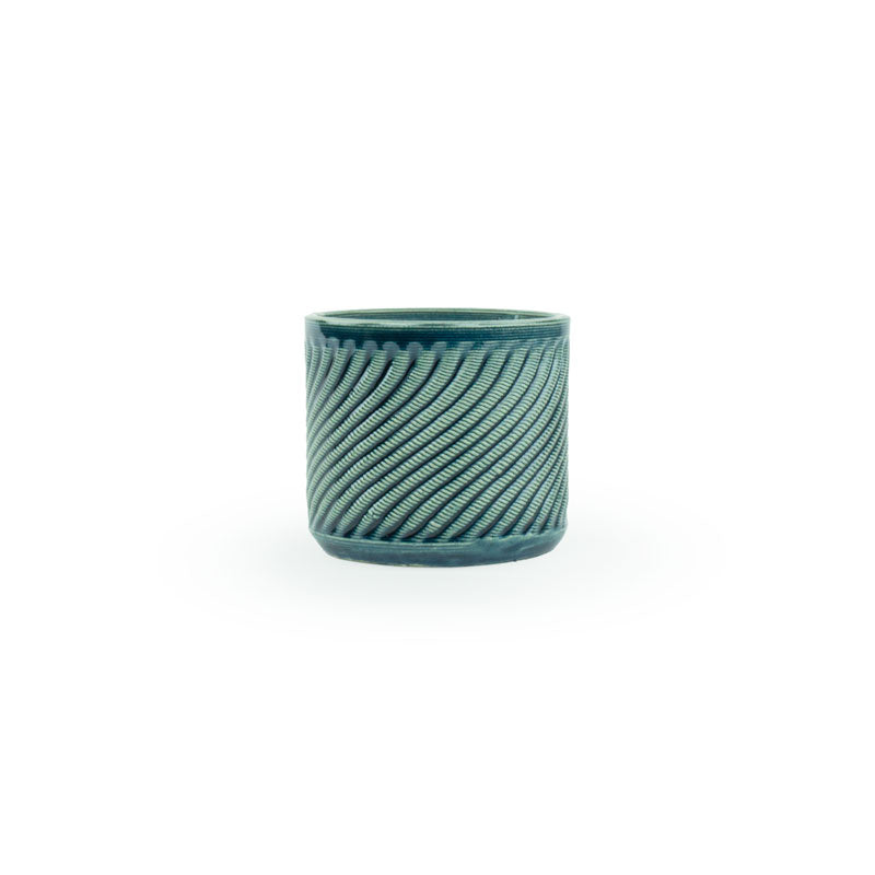 Storm colored 3D printed ceramic planter with a swirl pattern on a white background