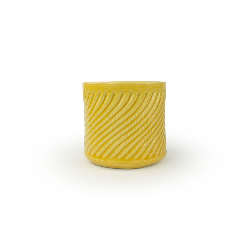 Marigold colored 3D printed ceramic planter with a swirl pattern on a white background