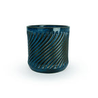Sapphire float colored 3D printed  ceramic planter with a swirl pattern on a white background