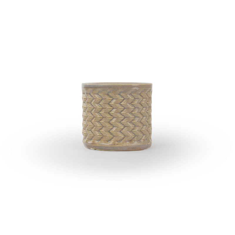 Light sepia colored 3D printed ceramic planter with a zig zag pattern, on a white background